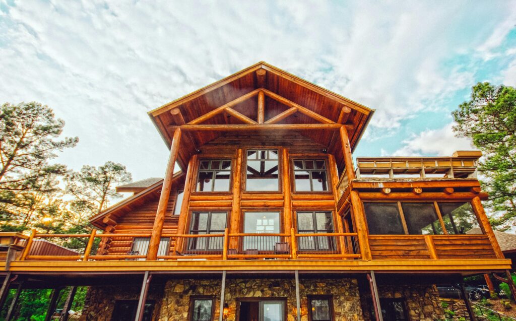 pexels-photo-2294125-2294125 A stunning log cabin with exposed logs and glass windows showcasing natural beauty.